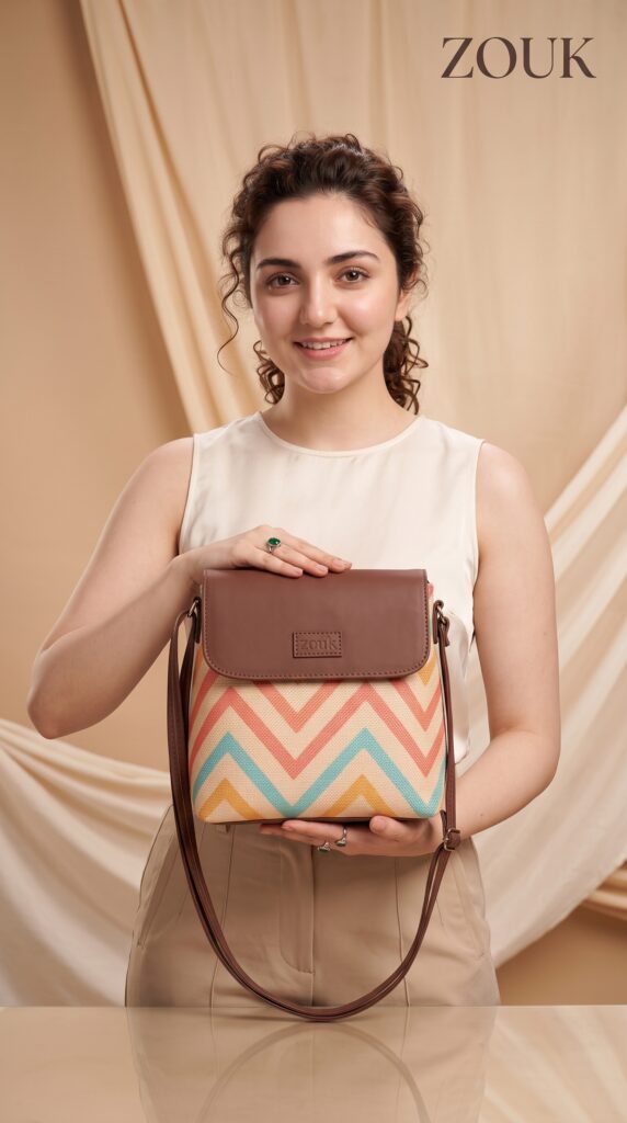 model holding zouk bag 2k 202607131113